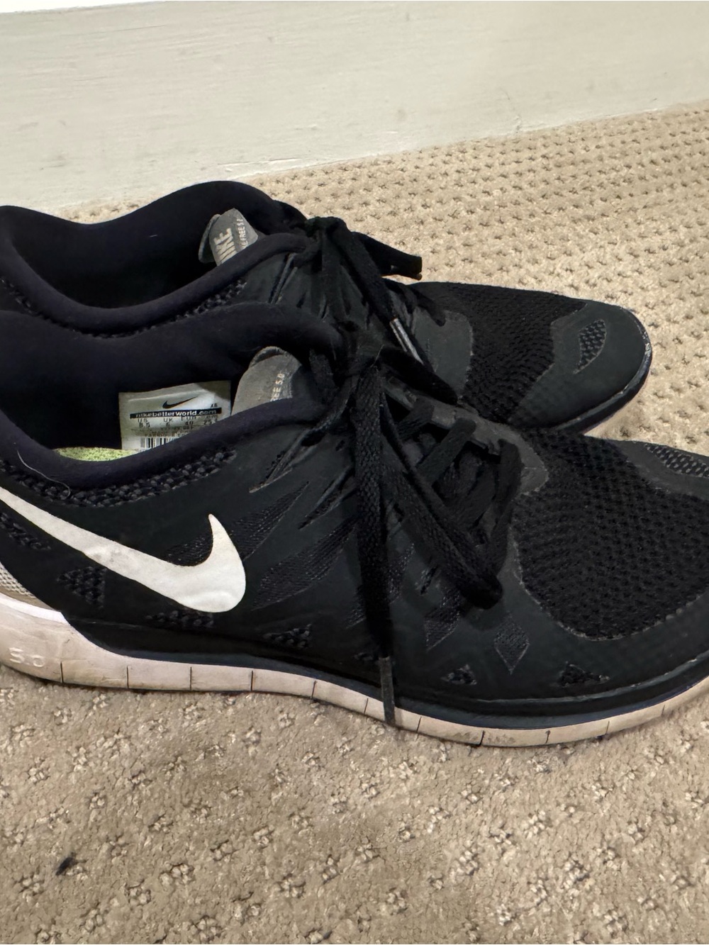 Nike Women’s Black Athletic Sneakers with White Swoosh